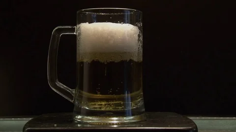 A large glass of cold and refreshing beer Stock Footage 75185368