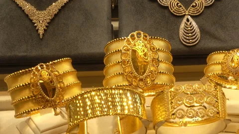 Large gold bracelets on a showcase Stock-Footage 128112673