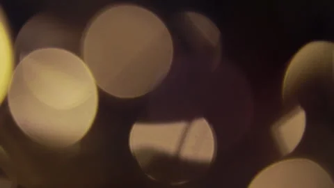 Large golden bokeh light leak in the background 库存影片 309575124