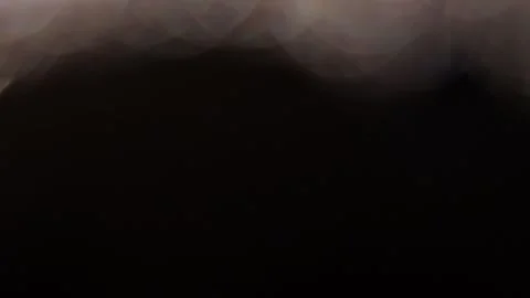 Large golden bokeh lights overlapping in the black Stock Footage 318664132