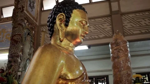 Large golden Buddha close-up Stock Footage 73318623