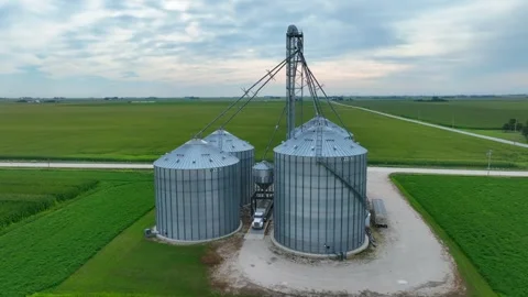 Large grain elevator in Midwest USA. Aerial orbit around crop storage Stock Footage 249811934