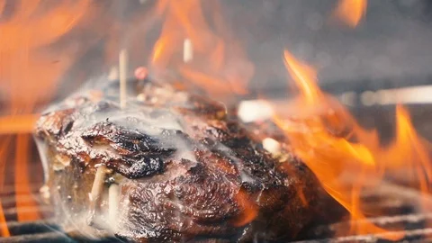 Large grains of pepper fall on juicy grilled filet mignon 動画素材 107740962