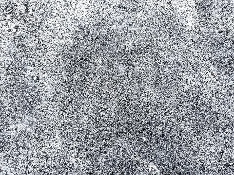 Large grainy vector grunge texture, white snow on black ice Stock-Illustration