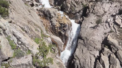A Large Granite Waterfall Meets a Pool Stock Footage 251314530