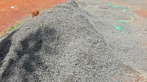 A large, gray mound of construction aggregate, likely crushed stone or metal 스톡 동영상 320796200