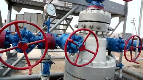 Large gray pipes with flanges and valves connected gas and oil refinery Stock Footage 223018536