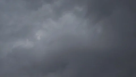 Large gray thunder clouds move quickly across the sky timelapse video Stock Footage 111861499