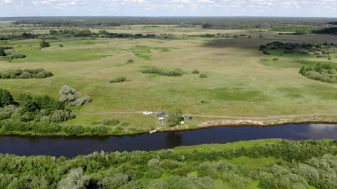 A large green field with trees in the background Video stock 147663598