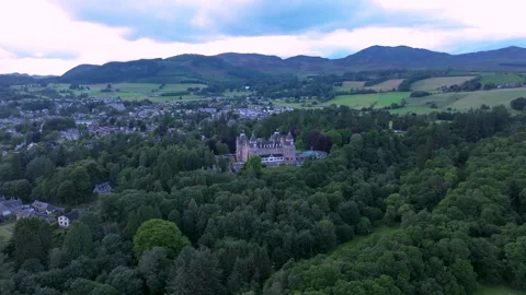 A large green forest with a Scottish castle in the middle Stock Footage 306624775