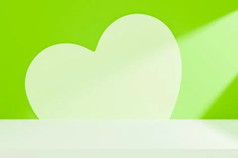 Large green heart icon on a simple green background Stock Illustration