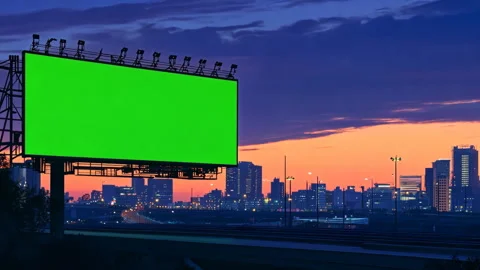 Large green screen chroma key billboard, sunset. Stock Footage 300678026