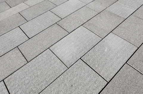 Large grey paving slabs close up. Stock Photos