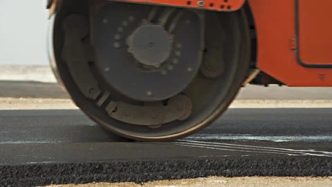 Large grey road roller drums align new highway gravel Stock-Footage 134460281