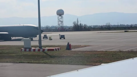 A large grey US Air Force military transport aircraft parked at Sofia Airport. Stock Footage 331784252