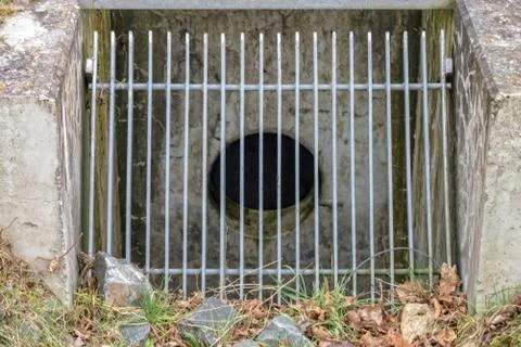 Large grid in front of a drainpipe Stock Photos