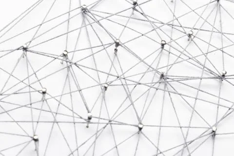 A large grid of pins connected with string. Communication, network concept Stock Photos