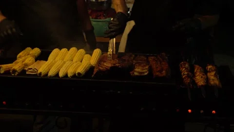 Large grill frying meal on the fire of coals of smoke Stock Footage 139095145