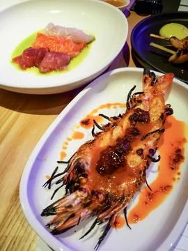 Large Grilled Marinated Split Shrimp on a serving plate Stock Photos