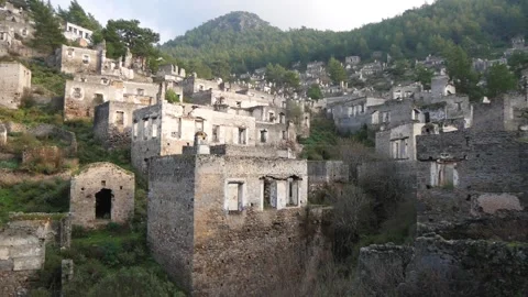 A Large Group Of Abandoned And Dilapidated Stone Houses On A Hillside Stock Footage 195989542