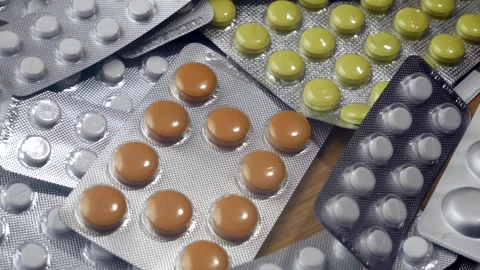 Large group of assorted capsules, pills, tablets and blisters, background, .. Stock Footage 258110639