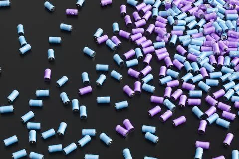 Large group of batteries on a black background. 3d render illustration. Illustrazione stock