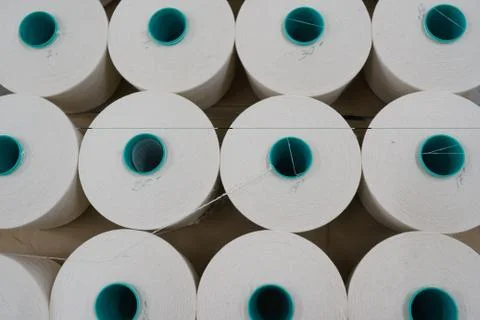 Large group of bobbin thread cones on a warping machine in a textile mill. Stock Photos