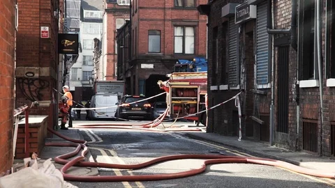 Large Group of British Fire Service attending scene in Manchester City Stock Footage 105857717