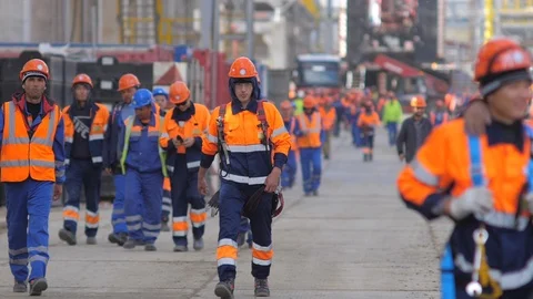Large group of builders goes to work 2 Stock Footage 106185262