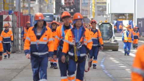 Large group of builders goes to work Stock Footage 106185485