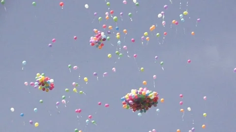 Large group of colorful balloons released into the sky during celebration Stock Footage 116903535