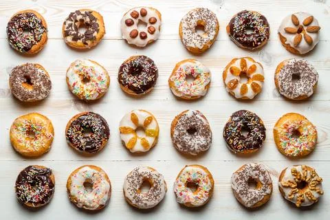 Large group of colorfully decorated donuts 写真素材