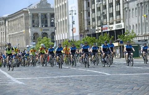 Large group of cyclists riding down the street road, bicycles. Cycle race amo Stock Photos