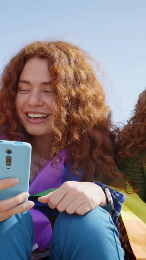 Large group diverse cheerful young people LGBT community sitting in line using Stock Footage 272706323