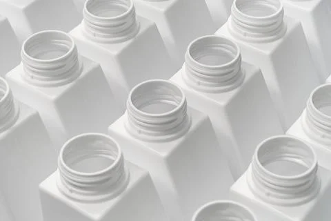 Large group of empty white plastic bottles Stock Photos