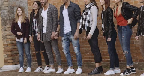 Large group of friends having fun outdoors. shot in slow motion Stock Footage 89614057