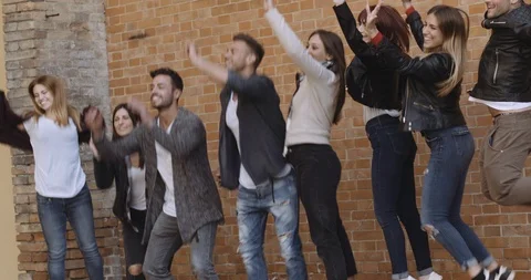 Large group of friends having fun outdoors. shot in slow motion Stock Footage 89614063