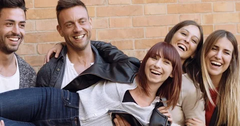 Large group of friends having fun outdoors. shot in slow motion Stock Footage 89614350