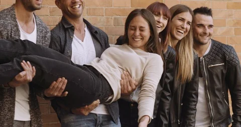 Large group of friends having fun outdoors. shot in slow motion Stock Footage 89614522