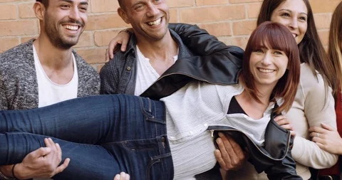 Large group of friends having fun outdoors. shot in slow motion Stock Footage 89614548