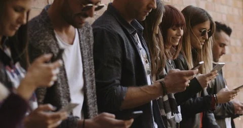 Large group of friends using cellphone. shot in slow motion Stock Footage 89613410