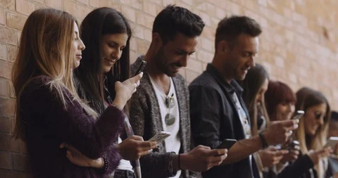 Large group of friends using cellphone. shot in slow motion Stock Footage 89613461