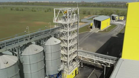 A large group of grain dryers complex for drying grain. A base of barns Stock Footage 133509446