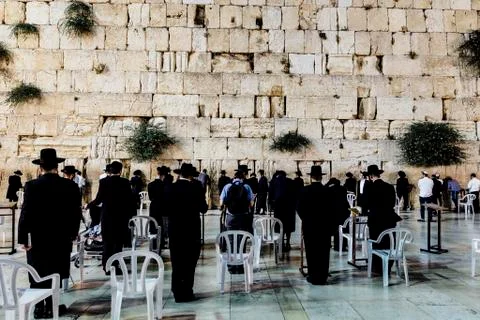 Large group of man  are praying in the westren wall jerusalem. Stock Photos