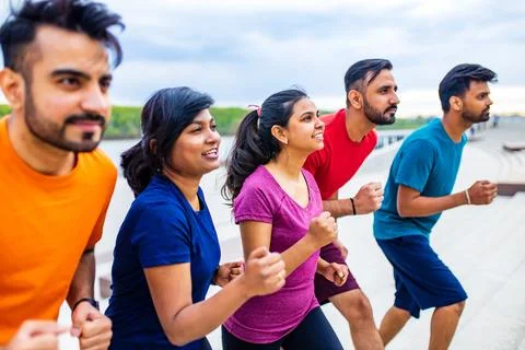 Large group of multi generation people running a race competition Stock Photos