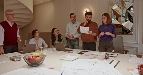 Large group of multi generational business team collaborating and brainstorming Stock Footage 273821026