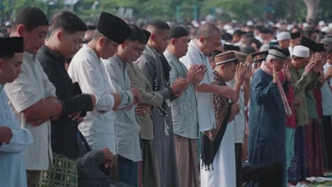Large group Muslim prayer Eid celebration in Indonesia Islamic worship gathering Видео 331213064