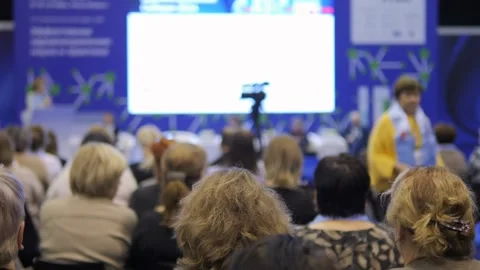A large group of people are sitting in a room Stock Footage 297841143