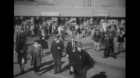 Large group of people coming out of building Stock Footage