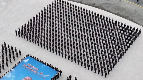 Large Group of People Form an Image and Flag on the Ground Stock Footage 341904276